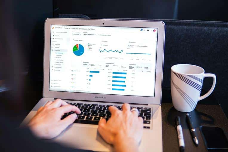 Someone looking at website analytics on a laptop