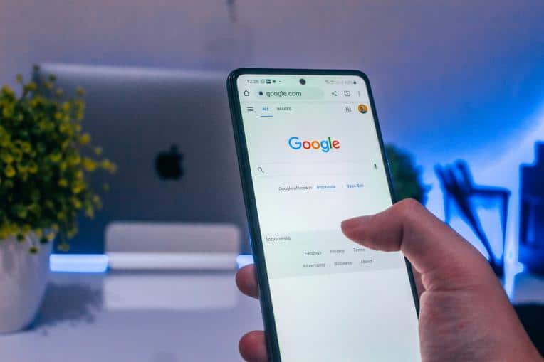Person performing a Google search on their phone